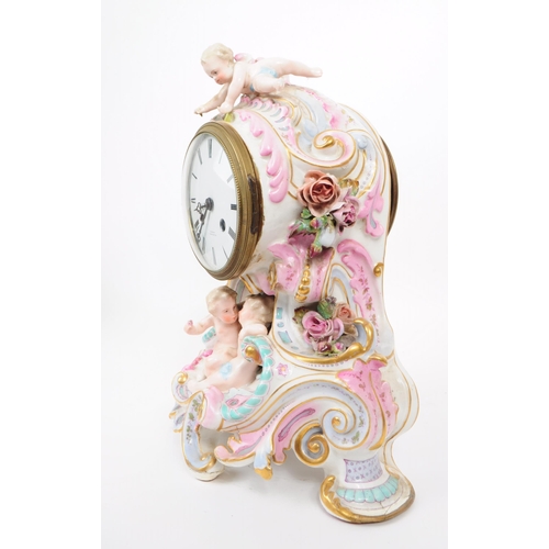 73 - Blaquart of Boulogne - Late 19th century German porcelain mantel clock. Features cherub figurines an... 