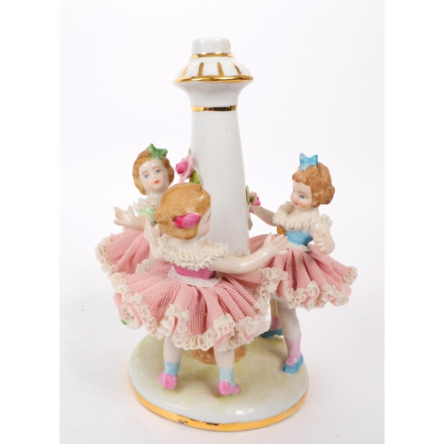 76 - Dresden - 20th century German porcelain figure / lamp base. Features three children dressed in pink ... 