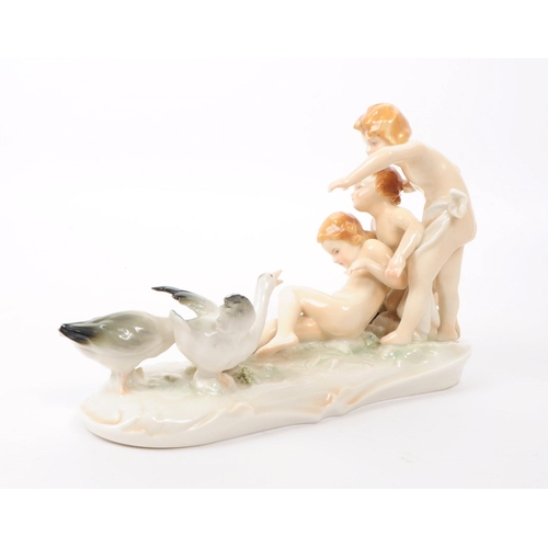 78 - Karl ENS - Volkstedt - Two early 20th century German porcelain figures. One depicting three cherubs ... 