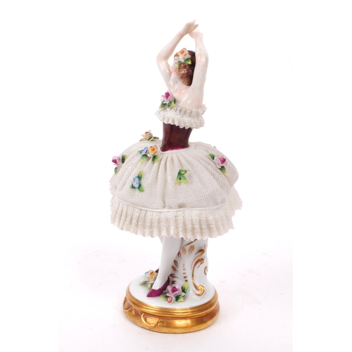 80 - Sitzendorf - 20th century German porcelain lady dancer figure. Featured in a lace dress encrusted wi... 