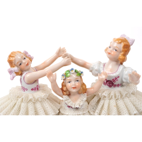 81 - Sitzendorf - 20th century German porcelain children figurine. Featuring three children in lace dress... 