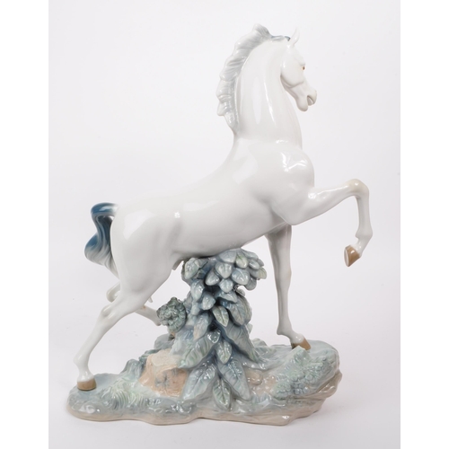 84 - Lladro - Late 20th century porcelain Caballo Arrogante horse / stallion figure. Depicting a white ho... 