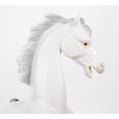 84 - Lladro - Late 20th century porcelain Caballo Arrogante horse / stallion figure. Depicting a white ho... 