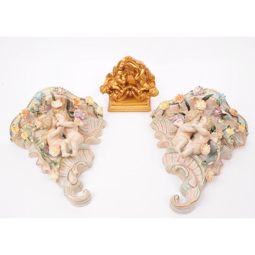 86 - Two 20th century German porcelain wall pocket / sconces in the shape of a cornucopia decorated with ... 