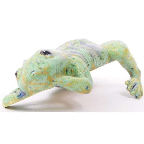 9 - A late 20th century Dutcher's Studio Monsterrat pottery frog figure, featuring shades of green, blue... 