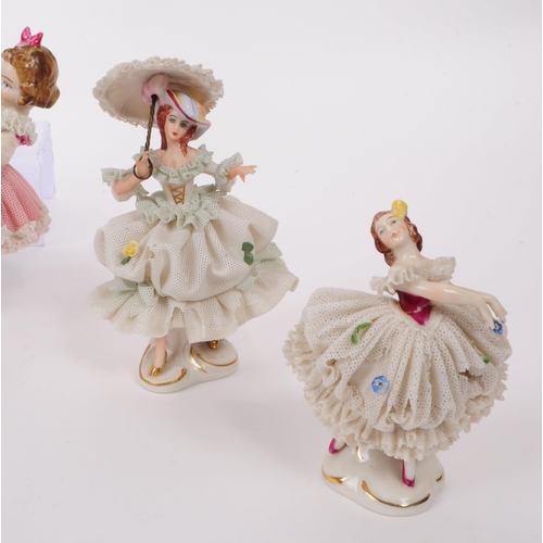 91 - Six 20th century German porcelain figurines, including Dresden and Volkstedt Rudolstadt examples. Co... 