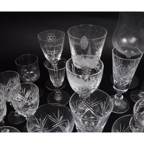 16 - A collection of 20th century crystal cut and acid etched glassware, including examples by Thomas Web... 