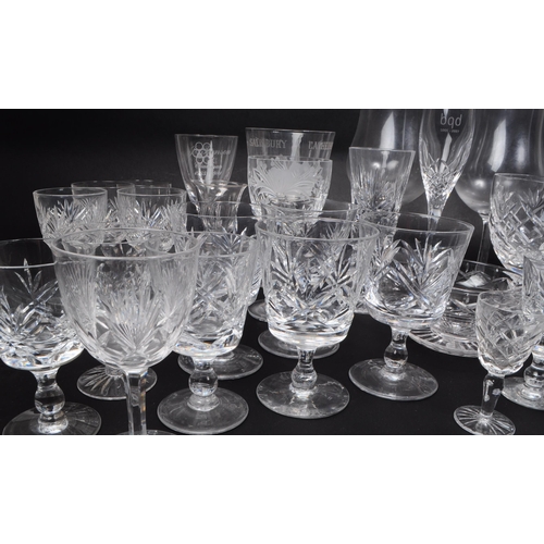 16 - A collection of 20th century crystal cut and acid etched glassware, including examples by Thomas Web... 