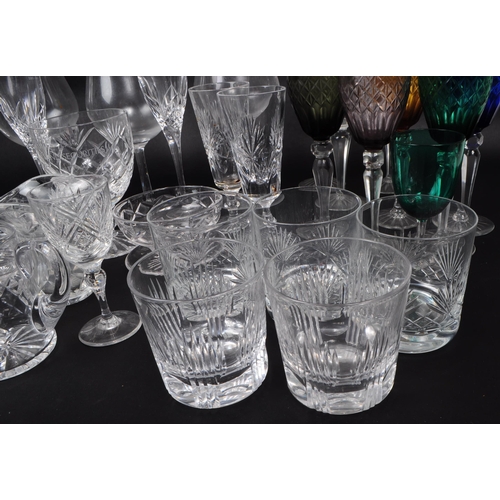 16 - A collection of 20th century crystal cut and acid etched glassware, including examples by Thomas Web... 