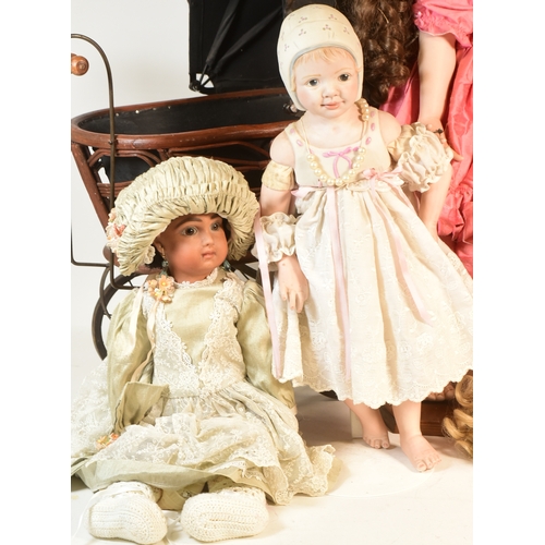 196 - Collection of 20th century porcelain dolls and pram. Dolls from makers such as Michele H Severine199... 