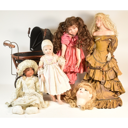 196 - Collection of 20th century porcelain dolls and pram. Dolls from makers such as Michele H Severine199... 