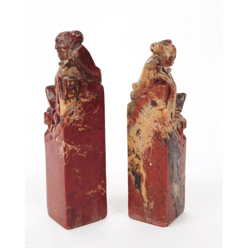 206 - Two early 20th century stone carved ornaments / book ends Red and white stone carved with Chinese fi... 