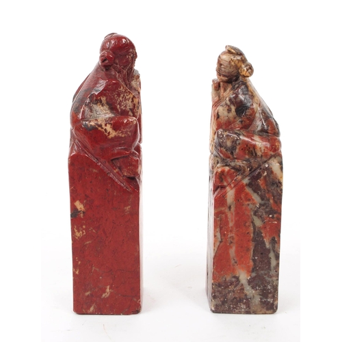 206 - Two early 20th century stone carved ornaments / book ends Red and white stone carved with Chinese fi... 