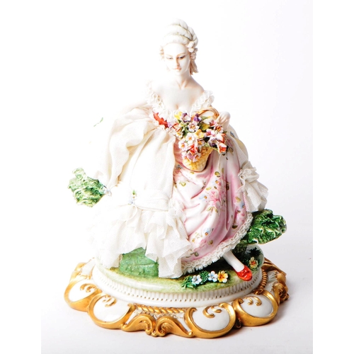 85 - Capodimonte - 20th century Italian porcelain lady figurine. Depicted in a lace dress holding a baske... 