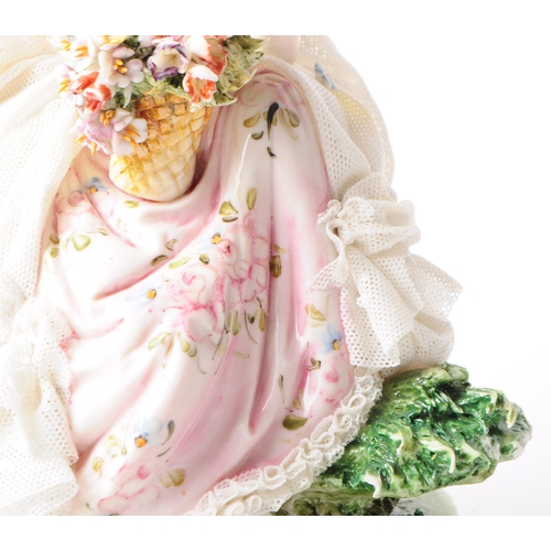 85 - Capodimonte - 20th century Italian porcelain lady figurine. Depicted in a lace dress holding a baske... 