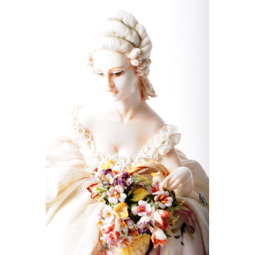 85 - Capodimonte - 20th century Italian porcelain lady figurine. Depicted in a lace dress holding a baske... 