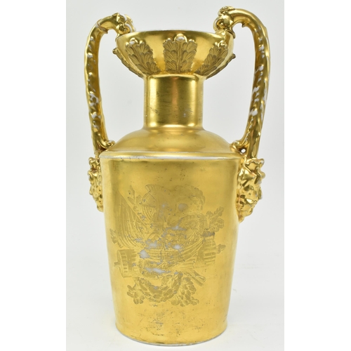 101 - A French Paris Porcelain 19th century gilt & transfer printed twin handled vase urn. The vase ha... 