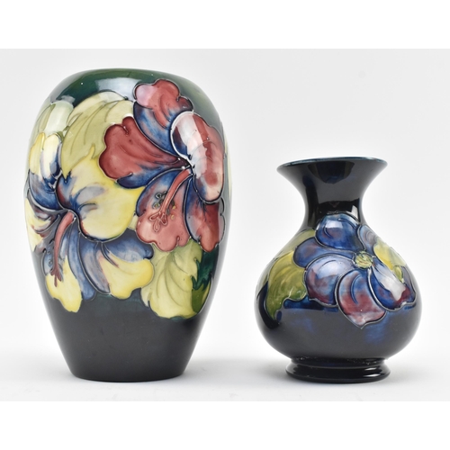 117 - Moorcroft Pottery - Two 20th century tube lined glazed ceramic vases in the Hibiscus and Anemone pat... 