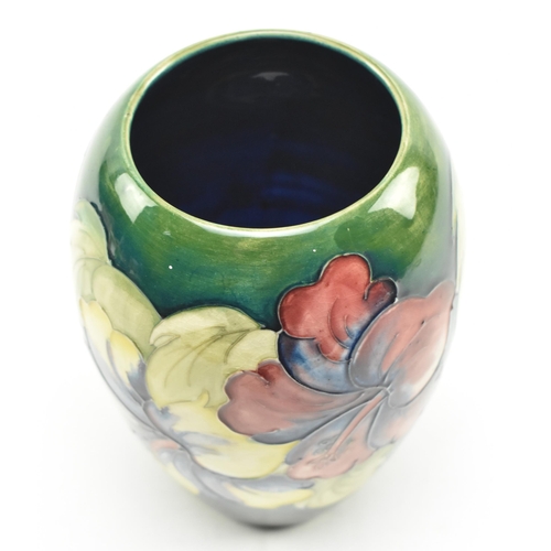 117 - Moorcroft Pottery - Two 20th century tube lined glazed ceramic vases in the Hibiscus and Anemone pat... 