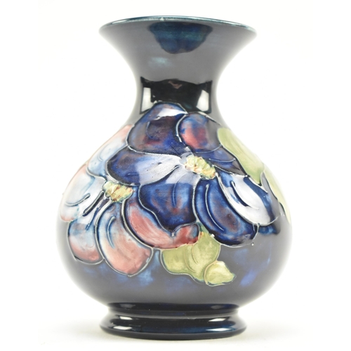 117 - Moorcroft Pottery - Two 20th century tube lined glazed ceramic vases in the Hibiscus and Anemone pat... 