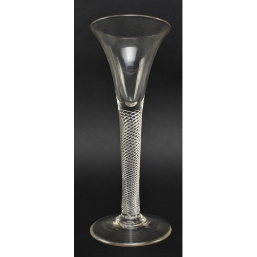 135 - An 18th century George III circa 1770 wine / cordial glass. The glass featuring trumpet bowl raised ... 