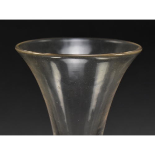 135 - An 18th century George III circa 1770 wine / cordial glass. The glass featuring trumpet bowl raised ... 