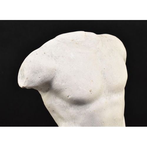 136 - A 20th century plaster figured sculpture of a male torso. The sculpture in a Neoclassical style, dep... 