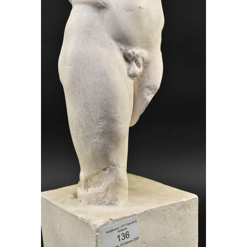 136 - A 20th century plaster figured sculpture of a male torso. The sculpture in a Neoclassical style, dep... 