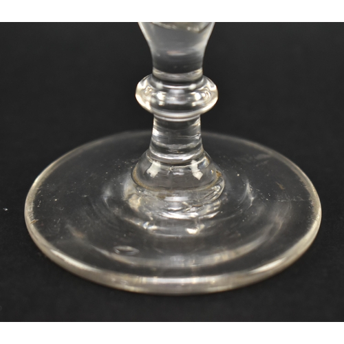 138 - A late 18th century George III circa 1770 ale glass. The glass with funnel bowl featuring engraved h... 