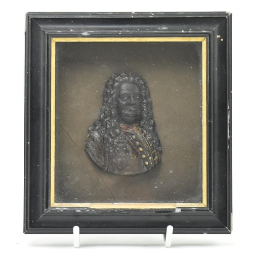 14 - A 19th century Victorian wax portrait of gentlemen. The wax portrait being set within a deep ebonise... 