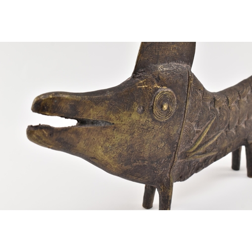 140 - A 19th century tribal West African Benin bronze fish sculpture. The fish depicting with open elongat... 