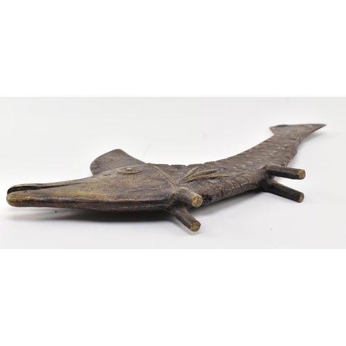 140 - A 19th century tribal West African Benin bronze fish sculpture. The fish depicting with open elongat... 