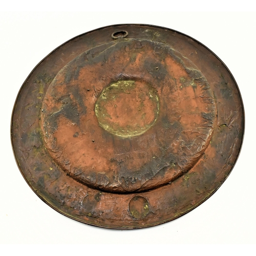 144 - A large 19th century continental wall hanging copper charger plaque. The plaque with relief central ... 