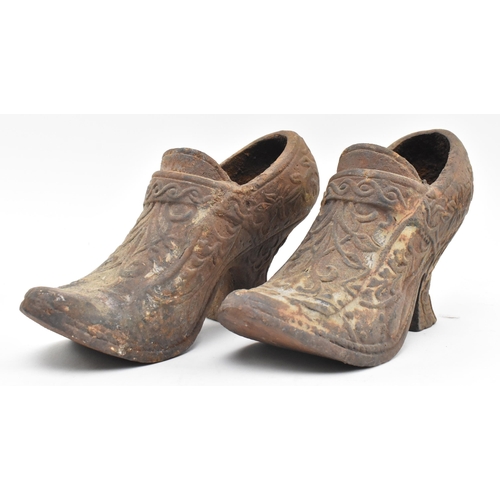 146 - A pair of 19th century cast iron believed Coalbrookdale Dutch style heeled shoes, formed as planters... 