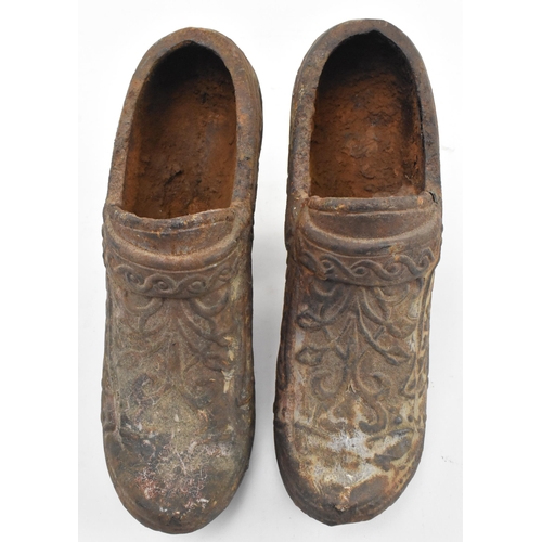 146 - A pair of 19th century cast iron believed Coalbrookdale Dutch style heeled shoes, formed as planters... 