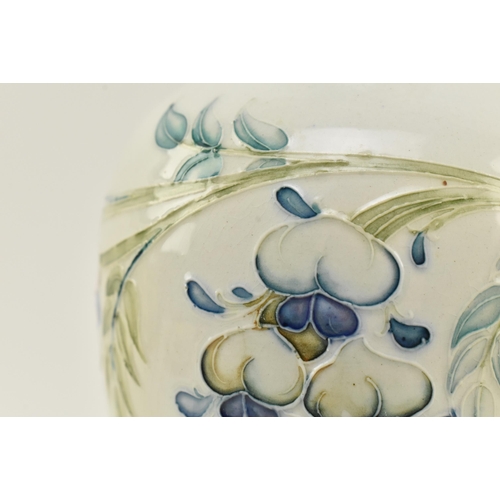 150 - William Moorcroft for Liberty & Co. - an early 20th century tube lined glazed ceramic vase in the Wi... 