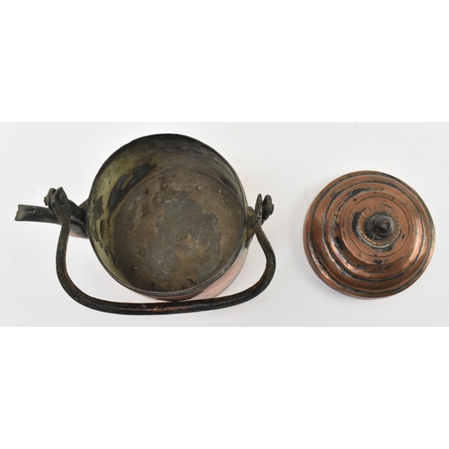 154 - A 17th century hand hammered copper kettle. The kettle featuring cast handle, the removable lid with... 