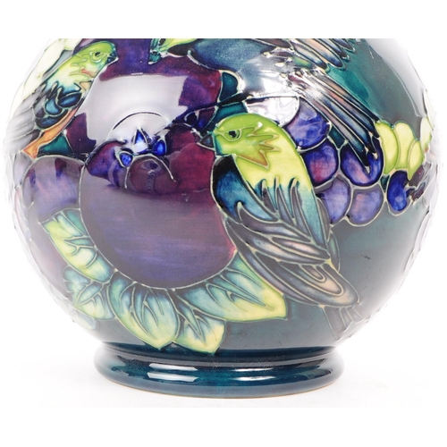 159 - Moorcroft - Finches and Fruit pattern - a late 20th century ceramic vase by Sally Tuffin. Bulbous fo... 