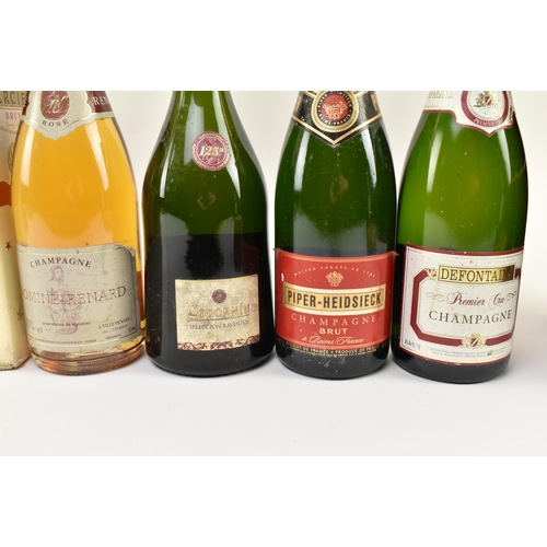 168 - A collection of nine vintage champagne and sparking wine bottles. The lot comprising Codorniu 125th ... 