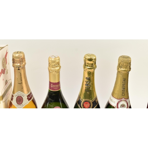 168 - A collection of nine vintage champagne and sparking wine bottles. The lot comprising Codorniu 125th ... 