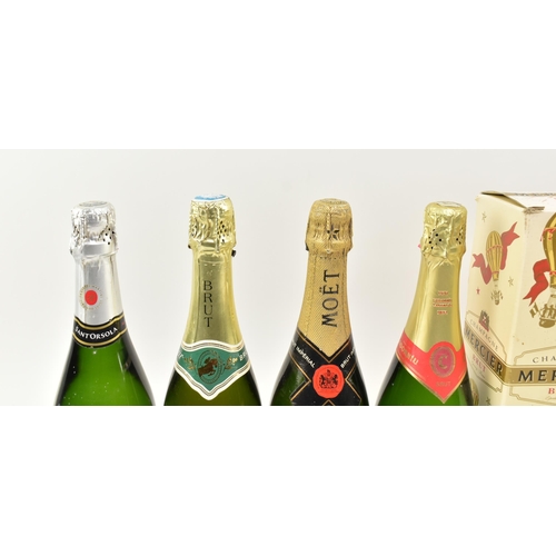 168 - A collection of nine vintage champagne and sparking wine bottles. The lot comprising Codorniu 125th ... 