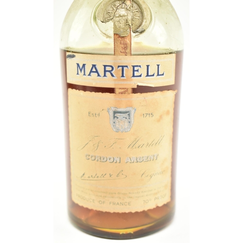 172 - A Martell Cordon Argent, 70 Proof, believed 1960s / 1970s cognac bottle. Seal appears intact but som... 