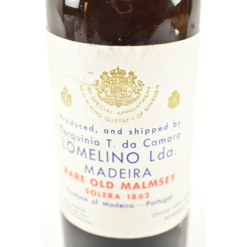 176 - An 1862 Solera Rare Old Malmsey Madeira Lomelino wine bottle. Produced and shipped by Tarquinio T. d... 