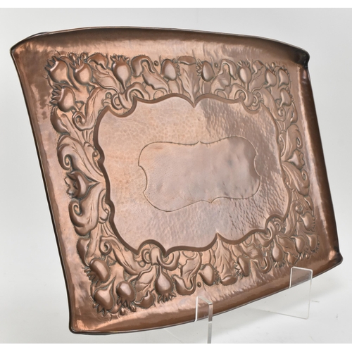 24 - Newlyn Copper - an early 20th century Arts and Crafts Cornish embossed copper 'Thistle' pattern tray... 