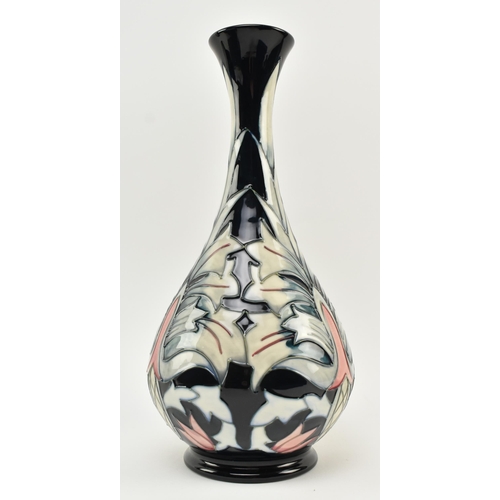 26 - William Moorcroft - Snakeshead pattern - a late 20th century ceramic vase. The vase of bulbous form ... 