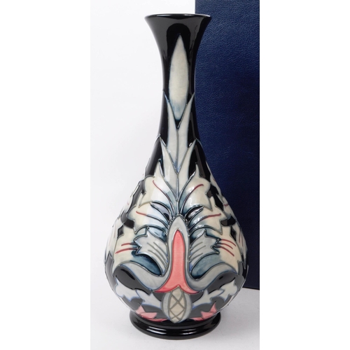 26 - William Moorcroft - Snakeshead pattern - a late 20th century ceramic vase. The vase of bulbous form ... 