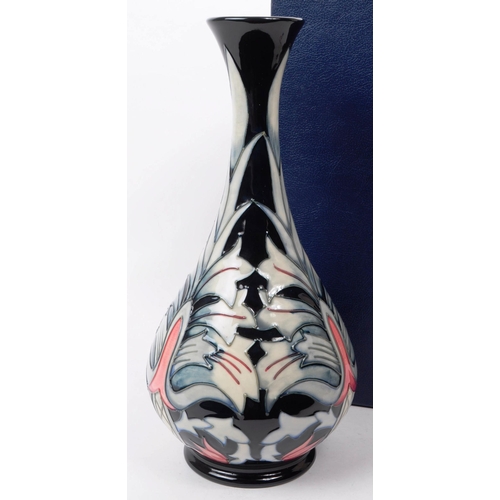 26 - William Moorcroft - Snakeshead pattern - a late 20th century ceramic vase. The vase of bulbous form ... 