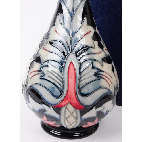 26 - William Moorcroft - Snakeshead pattern - a late 20th century ceramic vase. The vase of bulbous form ... 