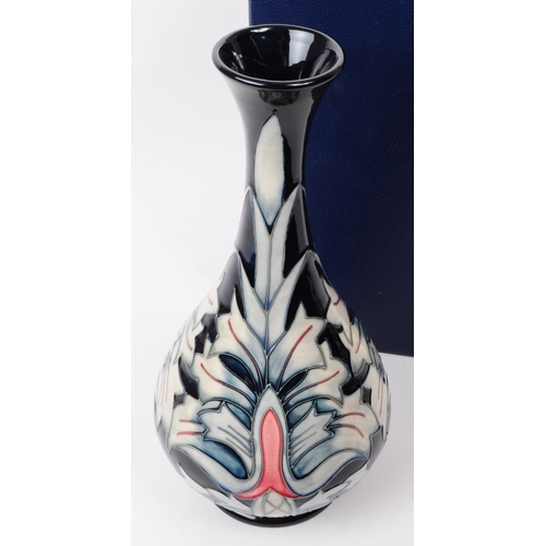 26 - William Moorcroft - Snakeshead pattern - a late 20th century ceramic vase. The vase of bulbous form ... 