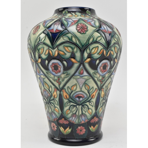 28 - Rachel Bishop for Moorcroft Pottery - Anatolia Pattern - a 2003 tube lined ceramic baluster shaped C... 